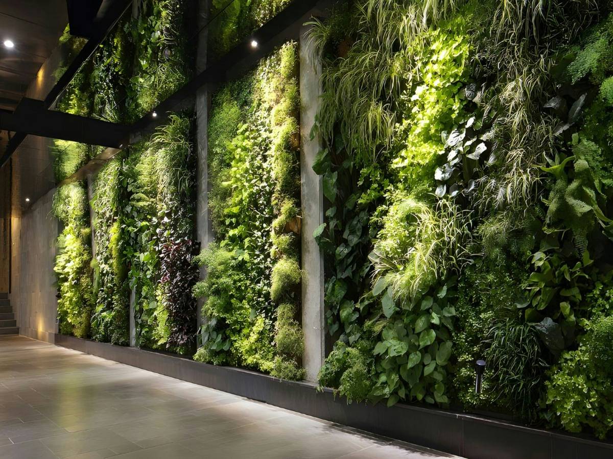 vertical terrarium background installed behind a live planted wall module showing layered sphagnum, coconut fiber, and embedded LED strip